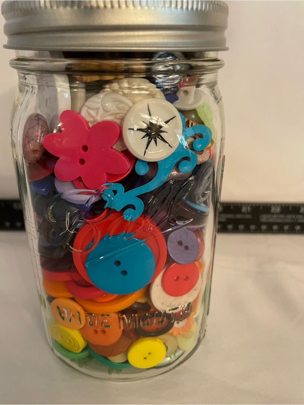 Quart size jar of buttons